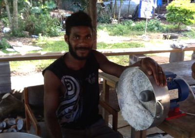 Man Scraping Coconut