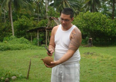 Man Splitting Coconut